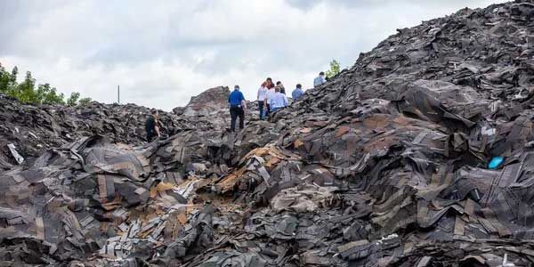 A large pile of waste material -Roof Rejuvenate pros