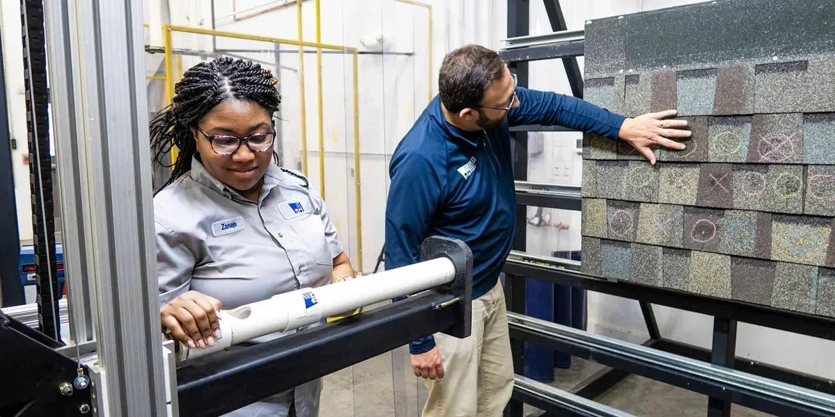 People testing asphalt shingles in lab- Roof Rejuvenate pros
